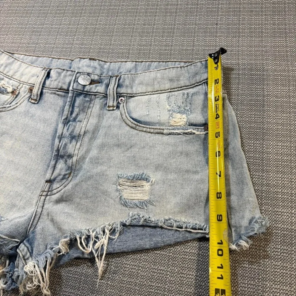 BDG Distressed blue denim shorts with frayed hem